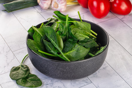 Raw fresh green spinach leaves in the bowl