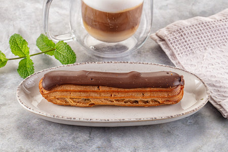 Gourmet chocolate eclair with brown icing