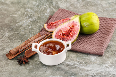 Sweet fig jam in the bowl served fruitの写真素材