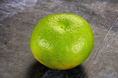 Green ripe fruit sweetie citrus over background