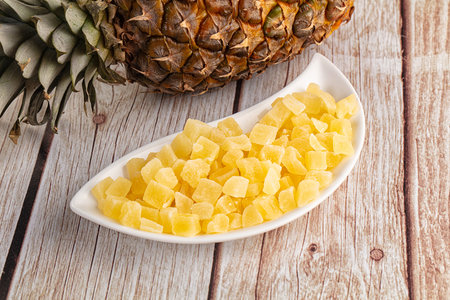 Dry yellow sweet pineapple candy cubesの写真素材