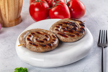 Grilled beef meat round circle sausagesの写真素材