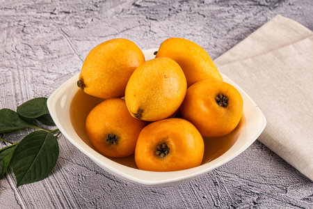 Ripe sweet juicy medlar fruit heap