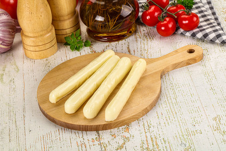 White mozzarella sticks over board snack
