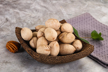 Crunchy pecan nut snack in the bowl