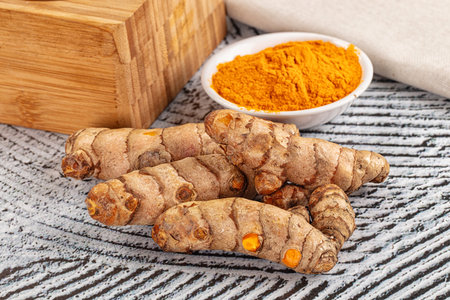 Fresh aroma tumeric roots heap served powder