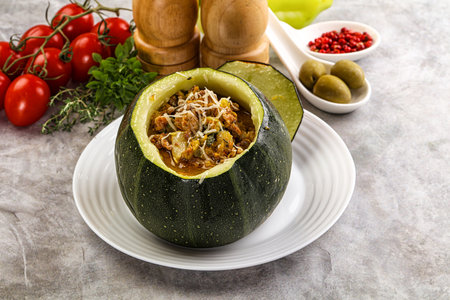 Baked round zucchini with meat and vegetablesの写真素材