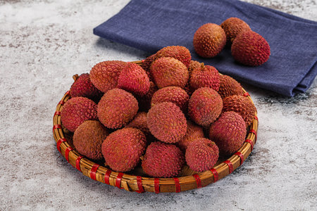 Sweet juicy tropical fruit lychee heap in the bowl