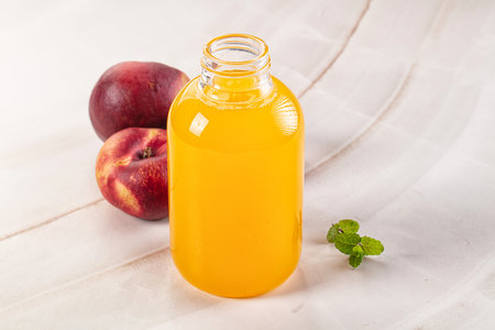 Vitamin beverage - peach juice glass served fruits