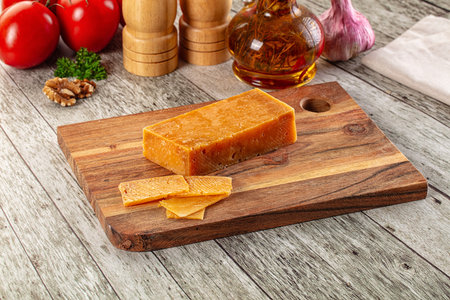 Gourmet hard aged parmesan cheese witj slicesの写真素材