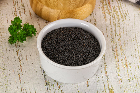 Black dry Nigella seeds in the bowl for culinary and medicineの写真素材