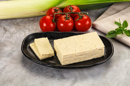 Soya vegan tofu cheese brick over board