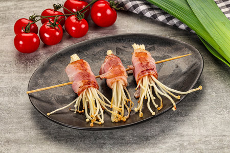 Grilled enoki mushroom with bacon roll wrapの写真素材
