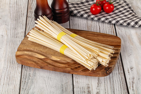 Raw dry wheat udon noodles for cookingの写真素材