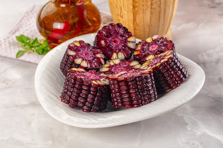 Ripe boiled black corn maize garnishの写真素材
