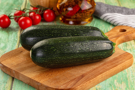 Young fresh raw green zucchini vegetableの写真素材