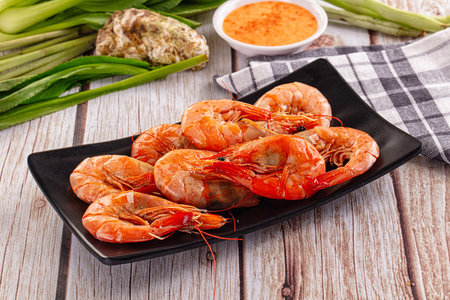 Delicous boiled tiger prawn with sauce for snackの写真素材