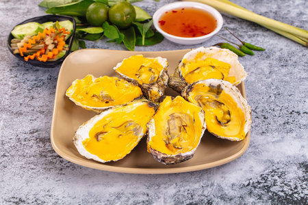 Baked hot oyster with cheddar cheeseの写真素材