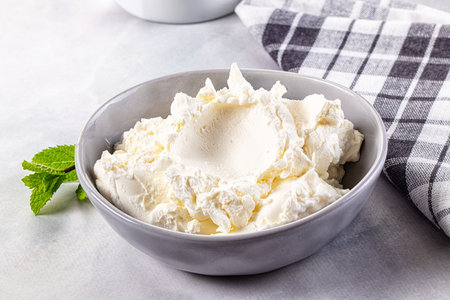 Cream cheese in the bowl served mintの写真素材