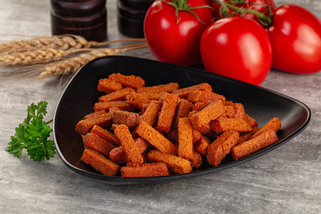 Crunchy croutons heap - roasted bread in the bowl