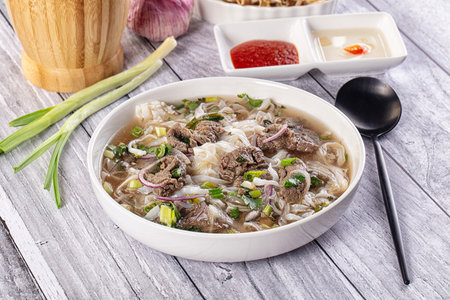 Vietnamese Pho Bo soup with beef and noodles