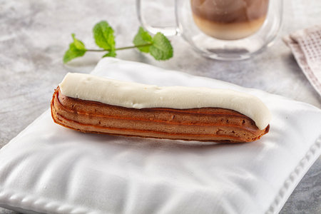 White delicous vanilla eclair with icing dessert