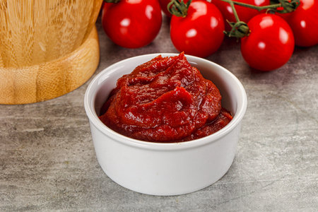 Red tomato paste sauce in the bowl
