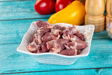 Raw chicken hearts for cooking in the bowl
