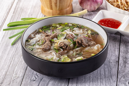 Vietnamese Pho Bo soup with beef and noodles