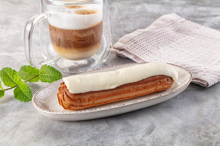 White delicous vanilla eclair with icing dessert