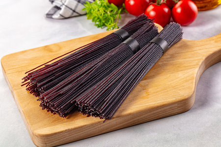 Raw black rice noodles lines pasta