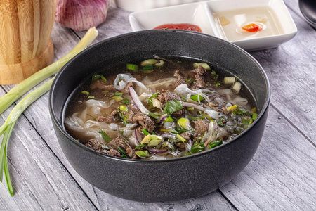 Vietnamese Pho Bo soup with beef and noodles
