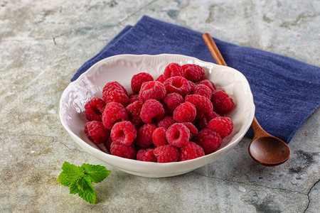 Organic ripe sweet juicy paspberry in the bowl