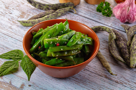 Steamed green bean strings heap with olive oil