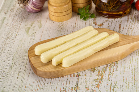 White mozzarella sticks over board snackの写真素材