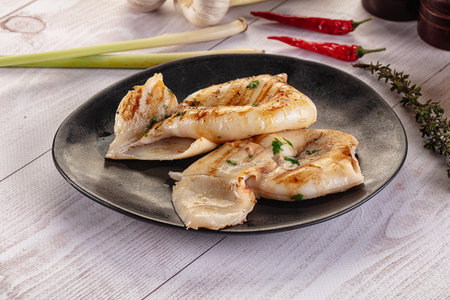 Fresh grilled calamari dietari protein with herbs