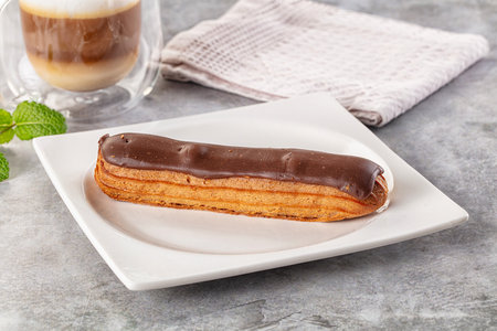 Gourmet chocolate eclair with brown icing