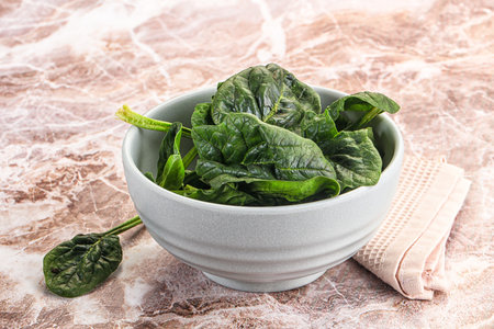 Fresh green spinach leaves heap in the bowl