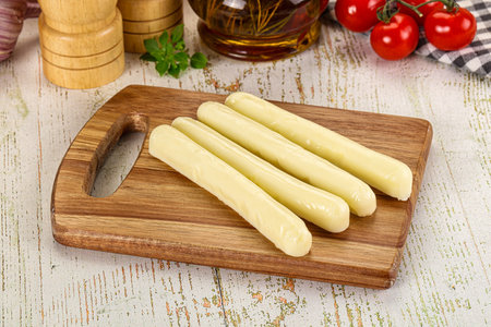 White mozzarella sticks over board snack
