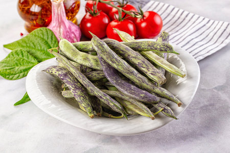 Raw green bean strips heap in the bowl