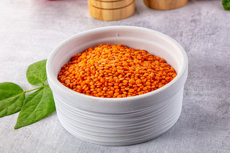 Raw dry red lentil in the bowl for coocking