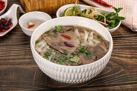 Vietnamese Pho Bo soup with beef, noodles, cilantro and spices