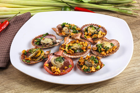 Baked scallops with scalion oil and green onionの写真素材