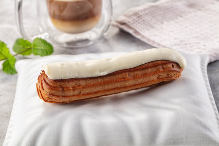 White delicous vanilla eclair with icing dessert