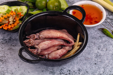 Boiled wild mini calamari snack with ginger