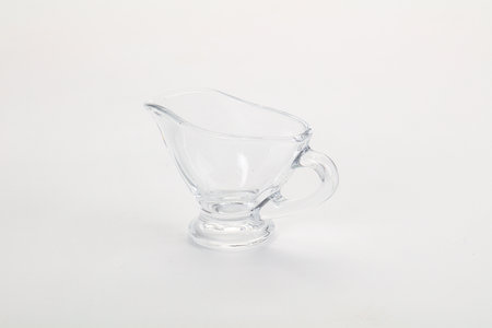 Empty gravy pot for sauce isolated dishwareの写真素材