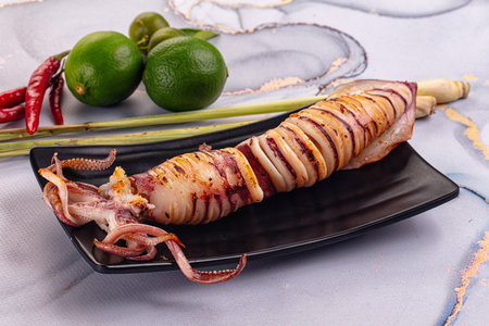 Tasty grilled wild squid with lime - Asian streetfood