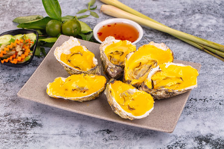 Baked hot oyster with cheddar cheese
