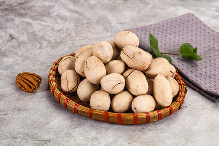 Crunchy pecan nut snack in the bowl