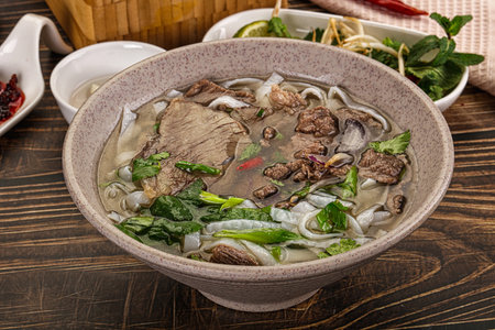 Vietnamese Pho Bo soup with beef, noodles, cilantro and spices